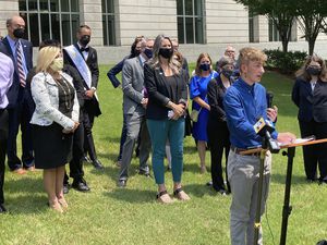 (Andrew DeMillo | AP) Dylan Brandt speaks at a news conference outside the federal courthouse in Little Rock, Ark., July 21, 2021. Brandt, a teenager, is among several transgender youth and families who are plaintiffs challenging a state law banning gender confirming care for trans minors.  A federal judge struck down Arkansas' first-in-the-nation ban on gender-affirming care for children as unconstitutional Tuesday, June 20, 2023.