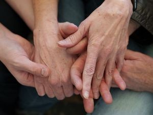 (Leah Hogsten | The Salt Lake Tribune)  New University of Utah research suggests if Utah wants to improve the wellbeing of women, making them feel safer will be key. Here, multiple generations grasp hands in connection, on Feb. 12, 2022.