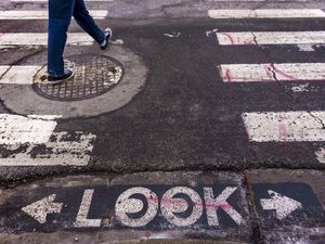 (Leah Hogsten | The Salt Lake Tribune)  A pedestrian crosses 200 South at Edison Street on Friday, February 3, 2023.