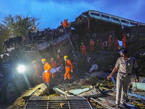 Rescuers carry the body of a victim at the site of passenger trains that derailed in Balasore district, in the eastern Indian state of Orissa, Saturday, June 3, 2023. Rescuers in India have found no more survivors in the overturned and mangled wreckage of two passenger trains that derailed, killing more than 280 people and injuring hundreds in one of the country’s deadliest rail crashes in decades. (AP Photo/Rafiq Maqbool)