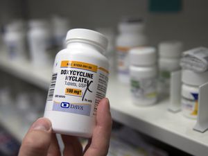 (Rich Pedroncelli | AP file photo) A pharmacist holds a bottle of the antibiotic doxycycline hyclate in Sacramento, Calif., July 8, 2016. On Tuesday, April 11, 2023, the Centers for Disease Control and Prevention released data about some of the most common infectious diseases in the U.S. The numbers show how chlamydia, gonorrhea and syphilis infections have been accelerating across the country. Meanwhile, the CDC is considering recommending the antibiotic doxycycline to be used after sex to prevent those infections.