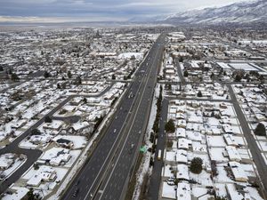 (Rick Egan | The Salt Lake Tribune)  Homes border both sides of the I-15 freeway, in Woods Cross, on Thursday, Jan. 5, 2023. UDOT proposes to widen the freeway from Farmington to northern Salt Lake City.
