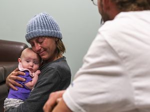 (Rick Egan | The Salt Lake Tribune) Bodhi and Jack King spend time with her daughter, Raya, during a supervised visit at the Department of Child and Family Services on Wednesday, Nov. 24, 2021. While homeless, the couple lost custody of Raya, and spent years to improve their lives in order to be reunited.